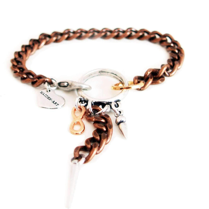 Copper bracelet with studs.